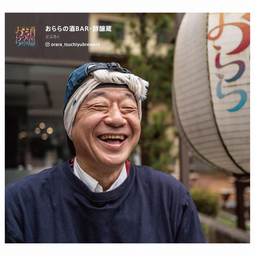 頭に手ぬぐいを巻いた笑顔の太田さんの写真